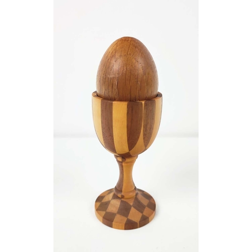 85 - A LINLEY PARQUETRY TURNED EGG CUP, pedestal base, complete with oak egg, 10cm high, stamped to under... 