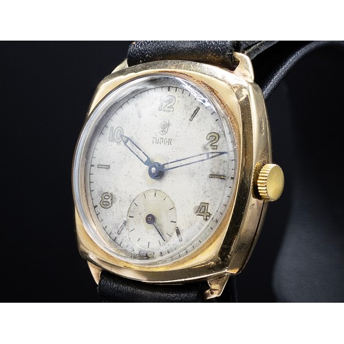 100 - A TUDOR 9CT YELLOW GOLD DENNISON WRISTWATCH, 1940's, with a cushion shaped case and sword shaped han... 