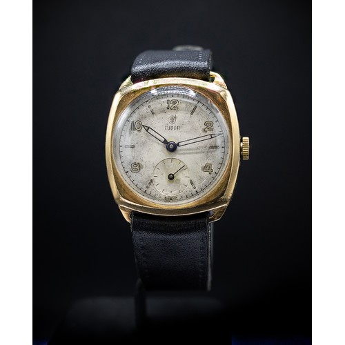 100 - A TUDOR 9CT YELLOW GOLD DENNISON WRISTWATCH, 1940's, with a cushion shaped case and sword shaped han... 