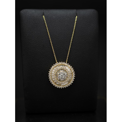 125 - AN 18CT YELLOW GOLD DIAMOND PENDANT NECKLACE, the circular pendant set with a seven stone diamond cl... 