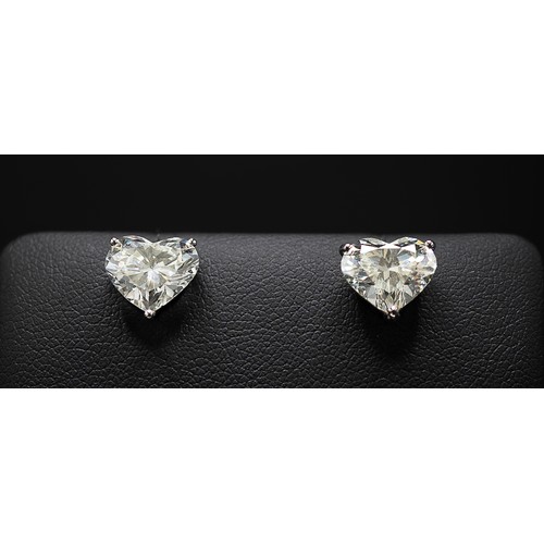 126 - A PAIR OF 18CT WHITE GOLD HEART SHAPED DIAMOND SOLITAIRE STUD EARRINGS, each brilliant cut stone of ... 