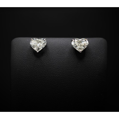 126 - A PAIR OF 18CT WHITE GOLD HEART SHAPED DIAMOND SOLITAIRE STUD EARRINGS, each brilliant cut stone of ... 