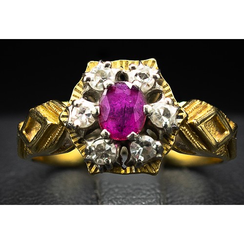 130 - AN 18CT YELLOW GOLD RUBY AND DIAMOND DRESS RING, the oval mixed cut ruby surrounded by six round bri... 