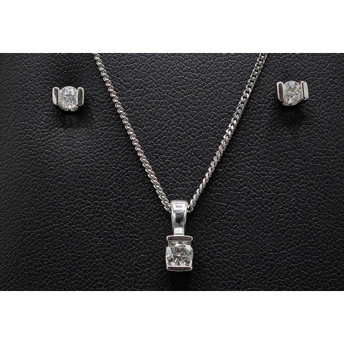 140 - A 9CT WHITE GOLD DIAMOND PENDANT NECKLACE AND EARRINGS SET, the pendant with a diamond solitaire of ... 