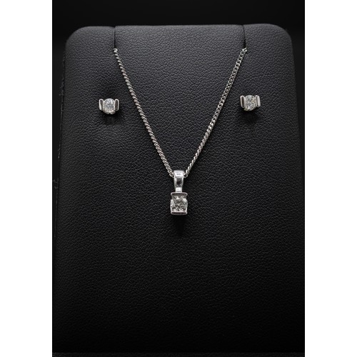 140 - A 9CT WHITE GOLD DIAMOND PENDANT NECKLACE AND EARRINGS SET, the pendant with a diamond solitaire of ... 