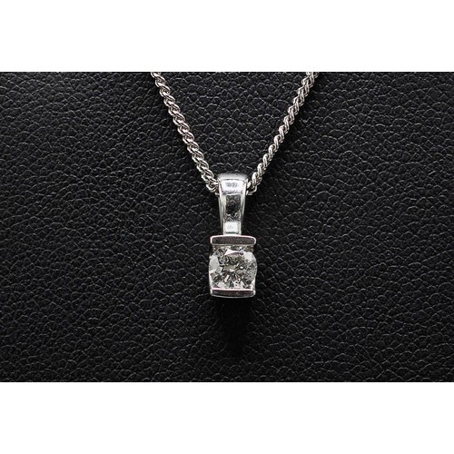 140 - A 9CT WHITE GOLD DIAMOND PENDANT NECKLACE AND EARRINGS SET, the pendant with a diamond solitaire of ... 