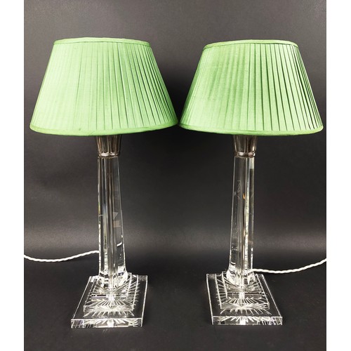 551 - TABLE LAMPS, a pair, with glass columns and plated collars, each 62cm H including green pleated shad... 