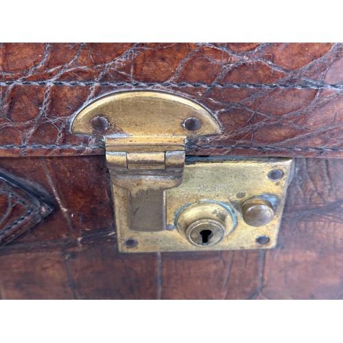 292 - SUITCASES,  two, vintage crocodile with gilt brass mounts together with a leather fitted shoe case. ... 