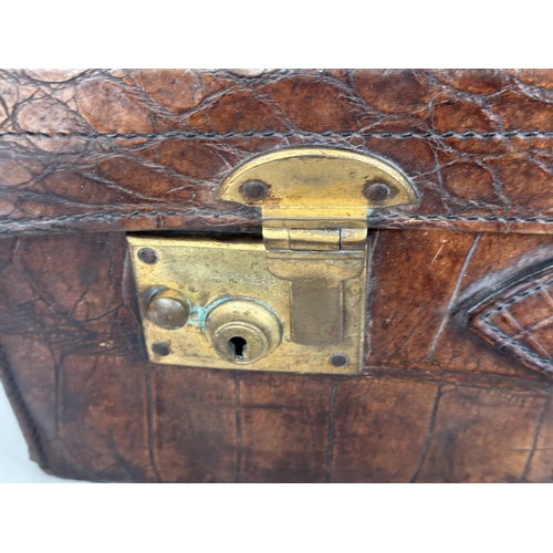 292 - SUITCASES,  two, vintage crocodile with gilt brass mounts together with a leather fitted shoe case. ... 