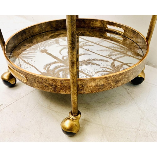 497 - DRINKS TROLLEY, gilt metal with three glazed tiers with palm tree decoration, 87cm H x 47cm W x 45cm... 