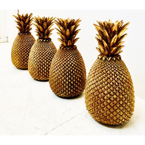 499 - DECORATIVE PINEAPPLES, a set of four, gilt finish, 32cm H x 27cm W x 17cm D. (4)