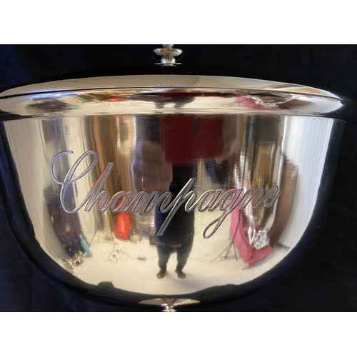 507 - CHAMPAGNE WINE COOLER ON STAND, polished metal, to hold four bottles.