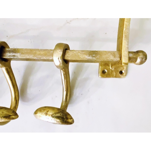 509 - LUGGAGE RACKS, a pair, gilt metal, each with four hangers, 35cm H x 46cm W x 27cm. (2)