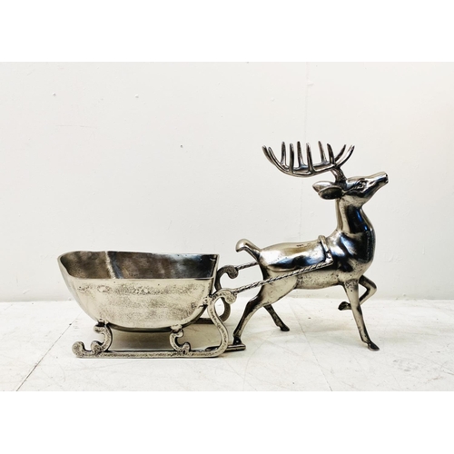 512 - FESTIVE CHAMPAGNE ICE BUCKET, in the form of a reindeer pulling a sleigh, 48cm H x 70cm W x 25cm D.