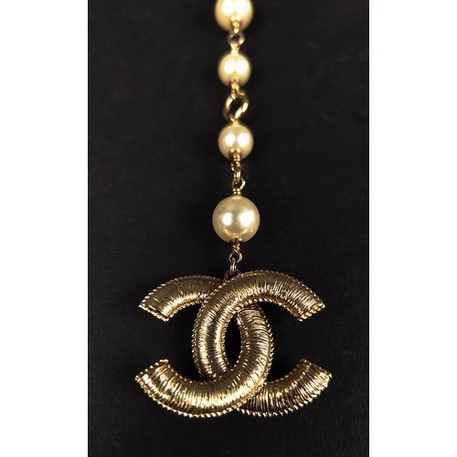 48 - CHANEL BELT/NECKLACE, with the double CC Chanel logo clasp with small faux stones and stylised flowe... 