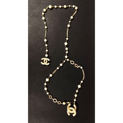 48 - CHANEL BELT/NECKLACE, with the double CC Chanel logo clasp with small faux stones and stylised flowe... 