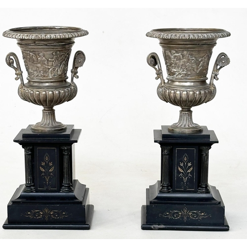 484 - TABLE VASES, a pair, 19th century neo classical style shelved metal urns on gilt incised plinths, 34... 