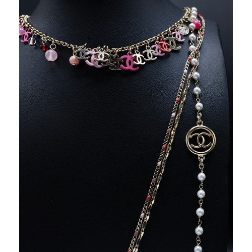 44 - CHANEL NECKLACE, four rows gold tone chain, with pearl beads and different tones of pink CC charms a... 