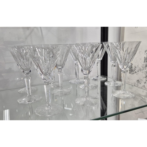 58 - WATERFORD CUT GLASSES, comprising six large wine glasses, eleven wine glasses, twelve small glasses,... 