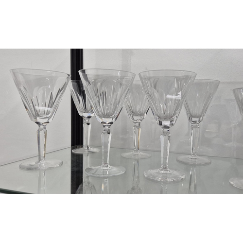 58 - WATERFORD CUT GLASSES, comprising six large wine glasses, eleven wine glasses, twelve small glasses,... 