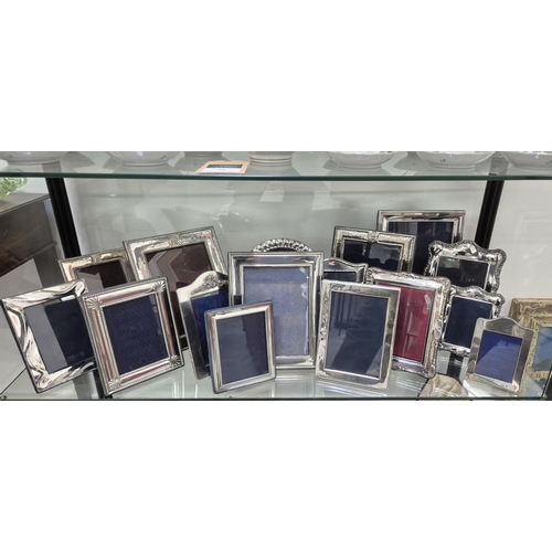 98 - A COLLECTION OF ASSORTED SILVER AND PHOTO FRAMES, of various sizes and designs, some with hand hamme... 