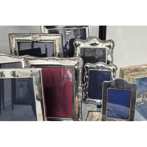 98 - A COLLECTION OF ASSORTED SILVER AND PHOTO FRAMES, of various sizes and designs, some with hand hamme... 