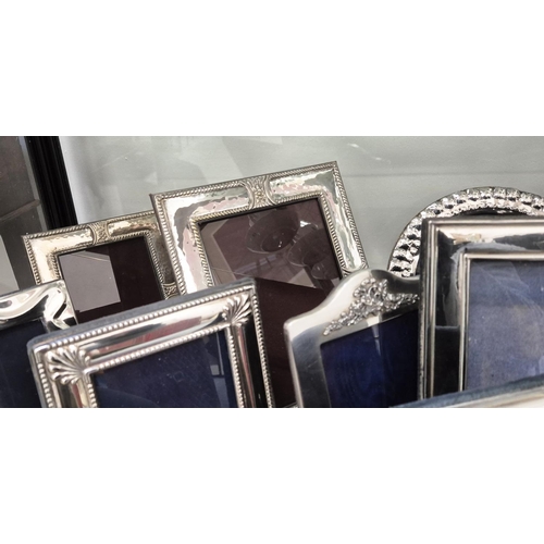 98 - A COLLECTION OF ASSORTED SILVER AND PHOTO FRAMES, of various sizes and designs, some with hand hamme... 