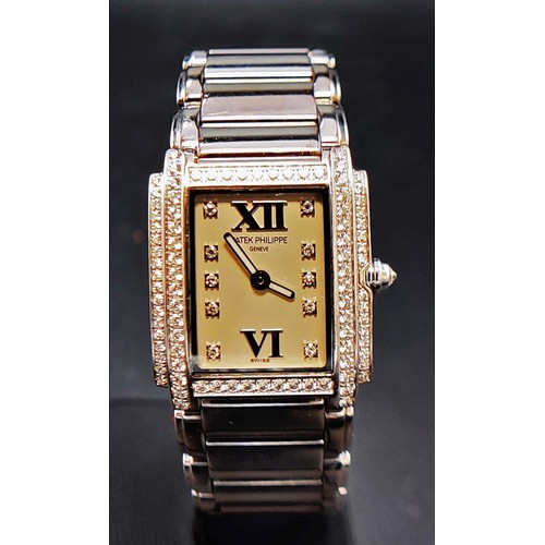 100A - A PATEK PHILIPPE 18CT WHITE GOLD AND DIAMOND SET WRISTWATCH, Geneve, set with approximately 88 round... 