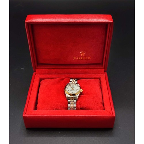 105A - A ROLEX OYSTER PERPETUAL DATEJUST LADIES WRISTWATCH, Champagne dial with Roman numerals, steel and g... 