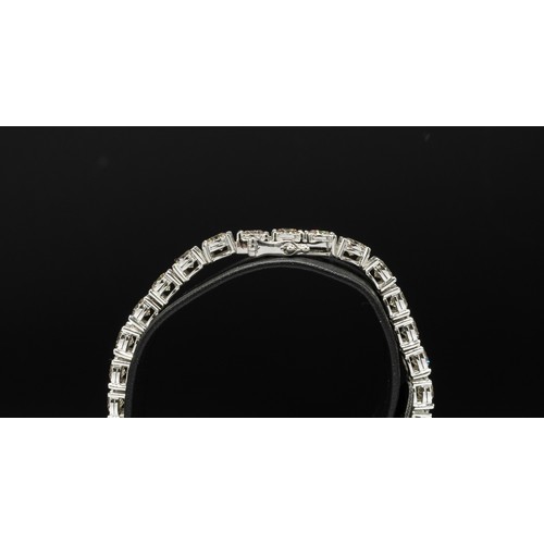 106 - A DIAMOND SET TENNIS BRACELET, encrusted with 35 round brilliant cut diamonds, with a total weight o... 