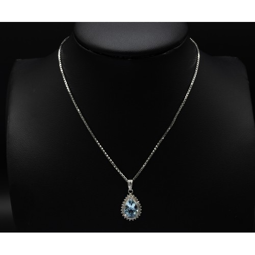 109 - PLATINUM PEAR SHAPED PENDANT, set with a pear shaped aquamarine and a halo of round brilliant cut di... 