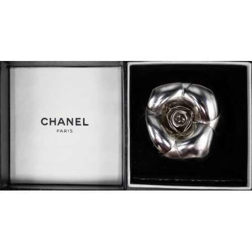 20A - CHANEL BROOCH, iconic camellia flower in silver tone metal, with safety pin closure, 5.5cm diam with... 