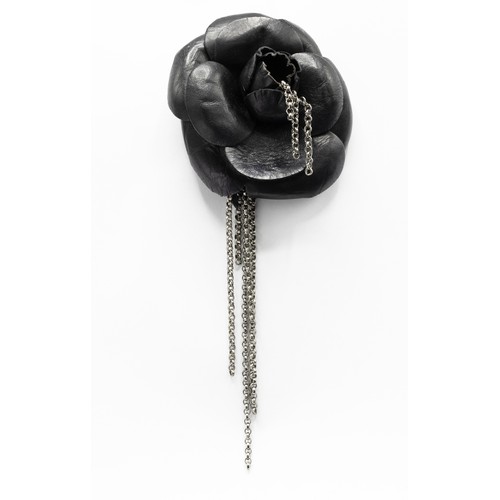 25A - CHANEL BROOCH, iconic camellia flower in black distressed calfskin leather and gun metal tone accent... 