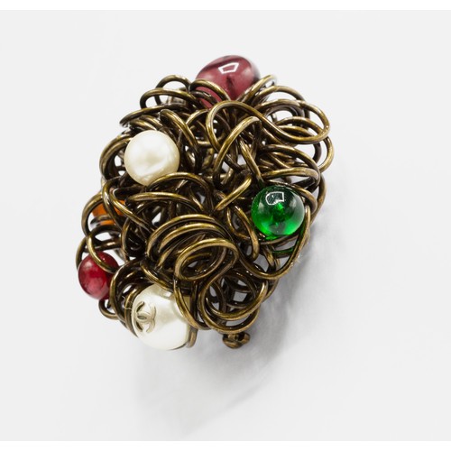 28A - CHANEL BROOCH, bronze tone metal with encrusted faux pearls and stones, with safety pin closure, wit... 