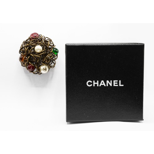 28A - CHANEL BROOCH, bronze tone metal with encrusted faux pearls and stones, with safety pin closure, wit... 