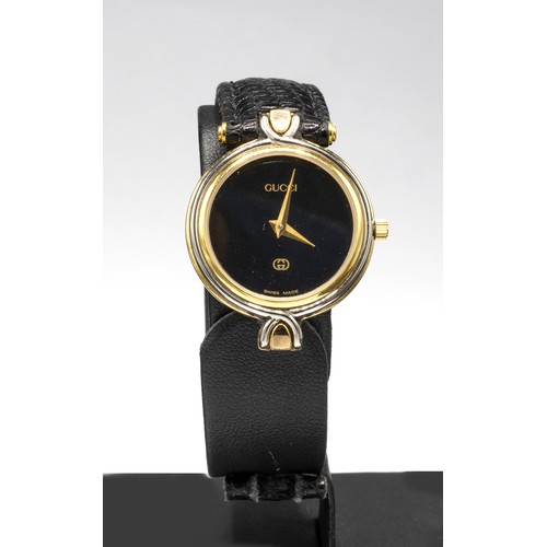 39 - GUCCI VINTAGE LADIES' WATCH, model 4500L, gold plated quartz, with leather strap, with box.