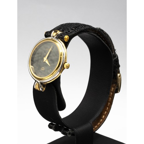 39 - GUCCI VINTAGE LADIES' WATCH, model 4500L, gold plated quartz, with leather strap, with box.