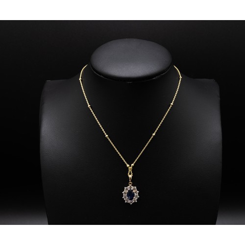 115 - A SAPPHIRE AND DIAMOND PENDANT NECKLACE, the central oval mixed cut sapphire of approximately 0.92 c... 