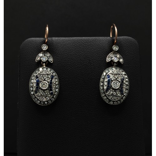 119 - YELLOW METAL AND SILVER TOPPED OVAL DROP EARRINGS SET, with eight cut and round brilliant cut diamon... 