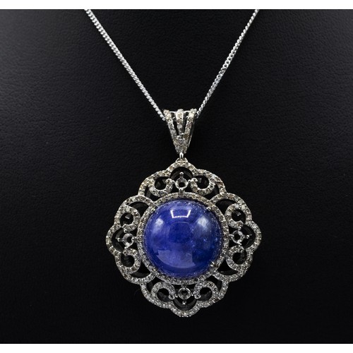 120 - ROUND CABOCHON TANZANITE AND DIAMOND FANCY PENDANT, in silver on a silver chain, boxed, Tanzanite 20... 