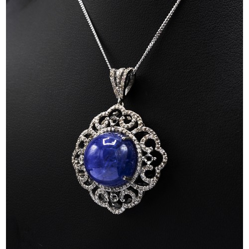 120 - ROUND CABOCHON TANZANITE AND DIAMOND FANCY PENDANT, in silver on a silver chain, boxed, Tanzanite 20... 