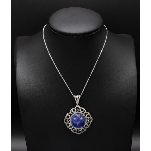 120 - ROUND CABOCHON TANZANITE AND DIAMOND FANCY PENDANT, in silver on a silver chain, boxed, Tanzanite 20... 