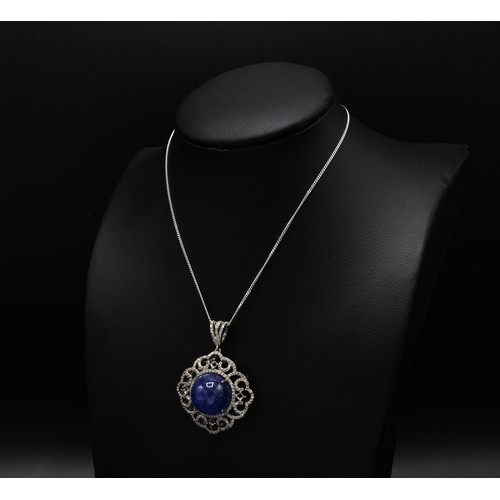 120 - ROUND CABOCHON TANZANITE AND DIAMOND FANCY PENDANT, in silver on a silver chain, boxed, Tanzanite 20... 