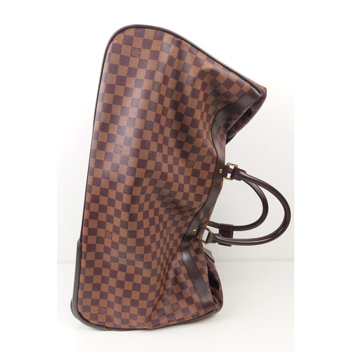 35A - LOUIS VUITTON EOLE ROLLING DUFFLE BAG, damier ebene coated canvas with fabric lining, top handles an... 