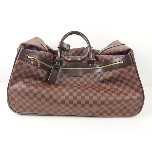 35A - LOUIS VUITTON EOLE ROLLING DUFFLE BAG, damier ebene coated canvas with fabric lining, top handles an... 