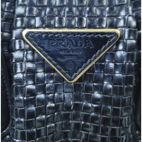 43A - PRADA HANDBAG, black weaved leather, gold tone hardware and bottom feet, two top handles, name tag, ... 