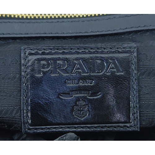 43A - PRADA HANDBAG, black weaved leather, gold tone hardware and bottom feet, two top handles, name tag, ... 