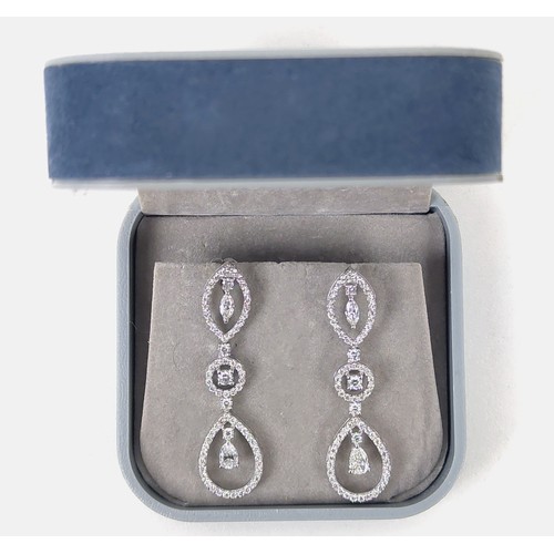 125A - A PAIR OF DIAMOND ENCRUSTED WHITE METAL PENDANT EARRINGS, possibly 18ct white gold, set with marquis... 