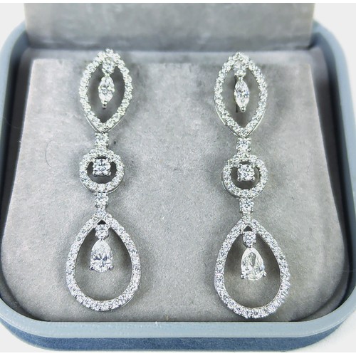 125A - A PAIR OF DIAMOND ENCRUSTED WHITE METAL PENDANT EARRINGS, possibly 18ct white gold, set with marquis... 