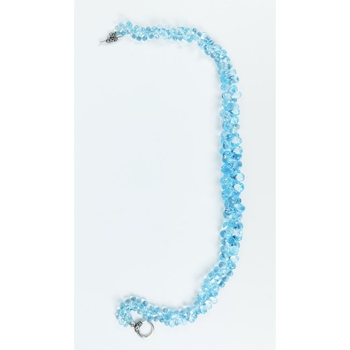 110A - A TOPAZ SINGLE STRAND FACETED BEAD NECKLACE, the Swiss blue topaz stones of pear shape and multiface... 